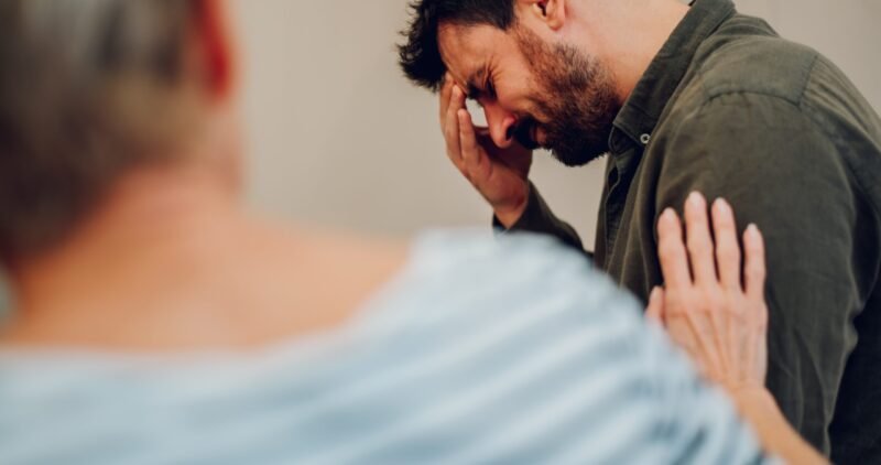 Portrait,Of,A,Sad,Young,Man,On,Group,Therapy,Meeting